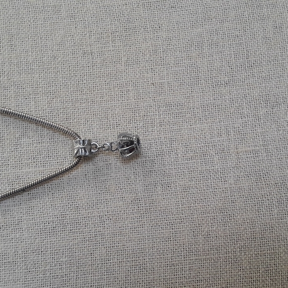 Silvertone Snake/rope Slide Necklace with Crown Charm - Picture 2 of 3